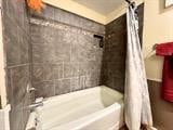 bathroom with shower / tub combo