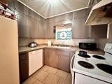 kitchen featuring light tile patterned floors and electric stove