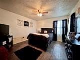 bedroom with wood-type flooring