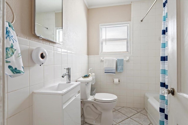 full bathroom featuring shower / bath combo, tile patterned flooring, tile walls, vanity, and toilet