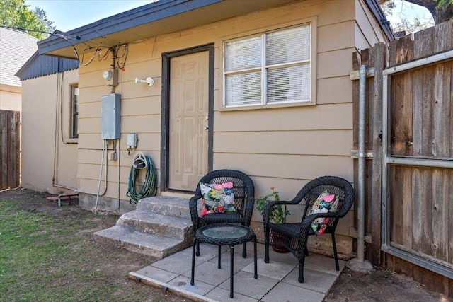 entrance to property with a patio area