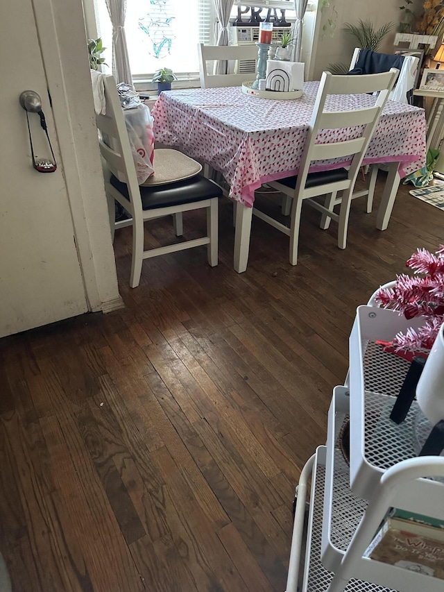 dining area featuring dark hardwood / wood-style floors