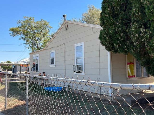 view of side of property with cooling unit