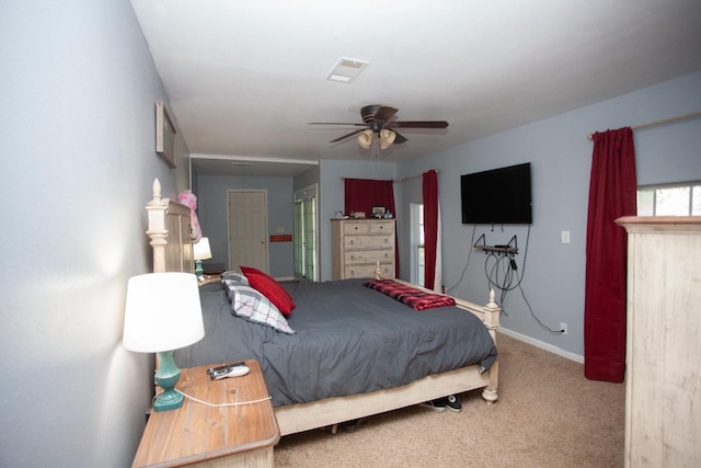 bedroom featuring ceiling fan and carpet