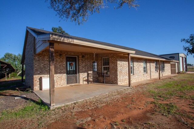 view of front of house with a patio area