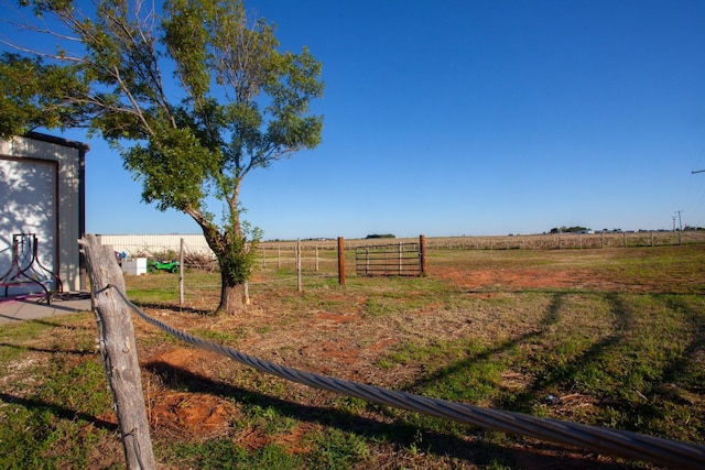 view of yard with a rural view