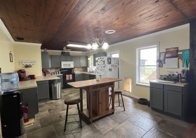 kitchen with crown molding, pendant lighting, wood ceiling, and white appliances