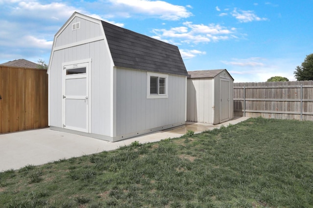 view of shed with a fenced backyard