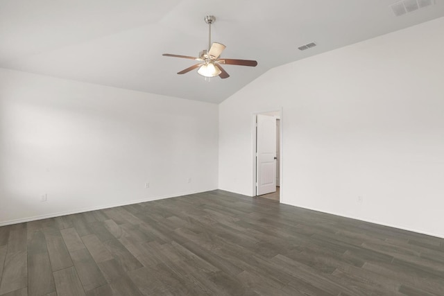 unfurnished room with ceiling fan, visible vents, vaulted ceiling, and dark wood-type flooring