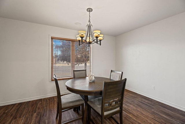 dining room featuring dark wood-type flooring and a notable chandelier