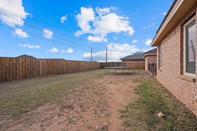 view of yard featuring a trampoline