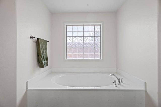 bathroom featuring a washtub