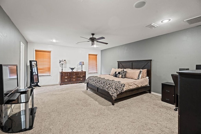 bedroom with light carpet and ceiling fan