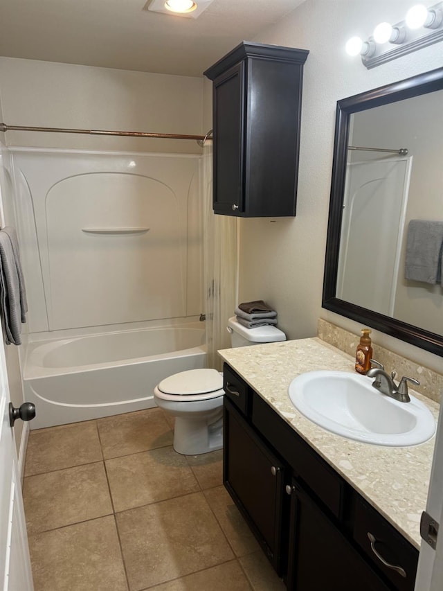 full bathroom with tile patterned flooring, vanity,  shower combination, and toilet