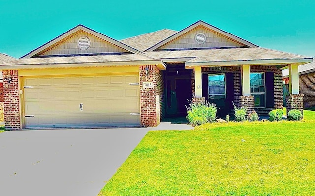 view of front facade with a garage and a front yard