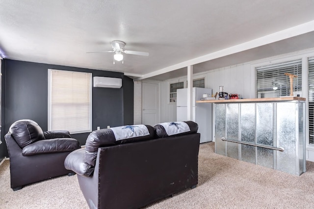 living room with ceiling fan, a wall mounted air conditioner, and light carpet