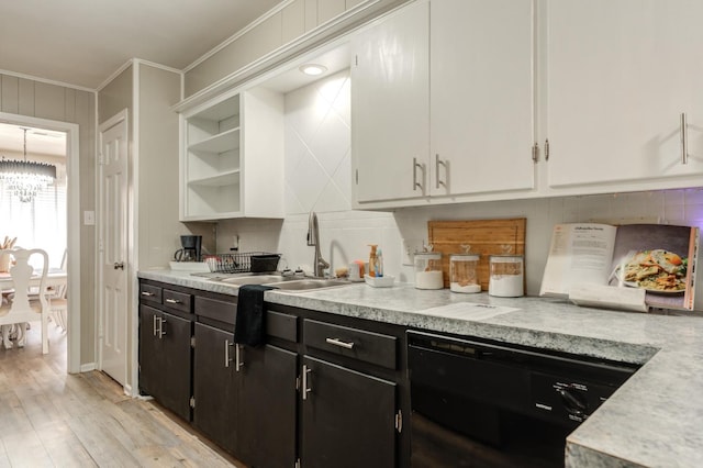 kitchen featuring sink, white cabinetry, crown molding, dishwasher, and light hardwood / wood-style floors