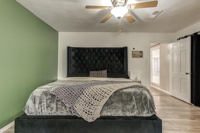 bedroom featuring ceiling fan and light hardwood / wood-style floors