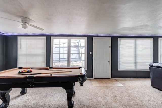 playroom with billiards, ceiling fan, light colored carpet, and a textured ceiling