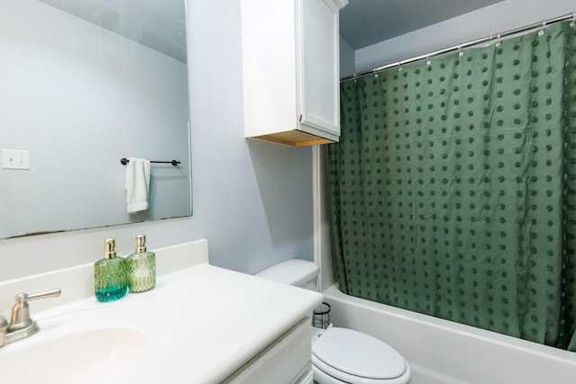 full bathroom featuring vanity, shower / bath combo, and toilet