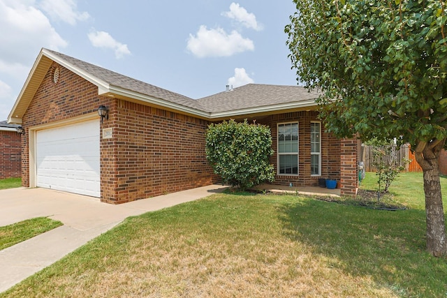 ranch-style house with a garage and a front yard