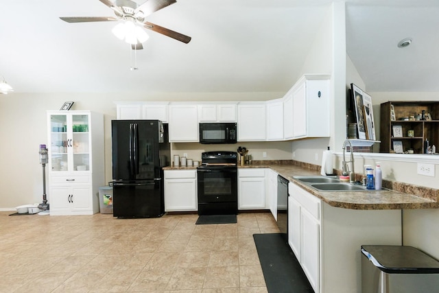 kitchen featuring vaulted ceiling, sink, white cabinets, ceiling fan, and black appliances