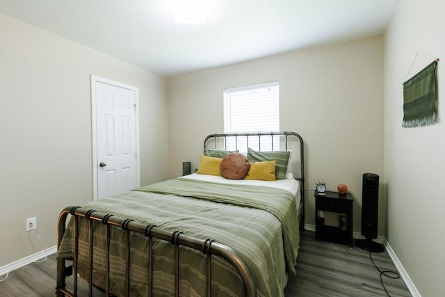 bedroom featuring dark hardwood / wood-style floors