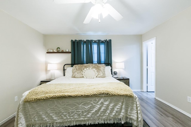 bedroom featuring hardwood / wood-style floors and ceiling fan