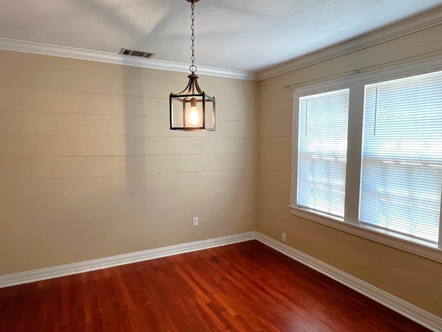 unfurnished dining area with wood-type flooring and ornamental molding