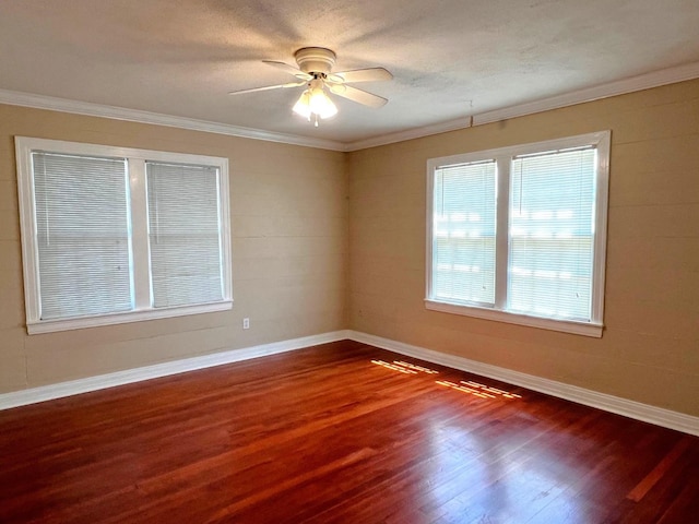 spare room with wood-type flooring, a textured ceiling, ceiling fan, and crown molding