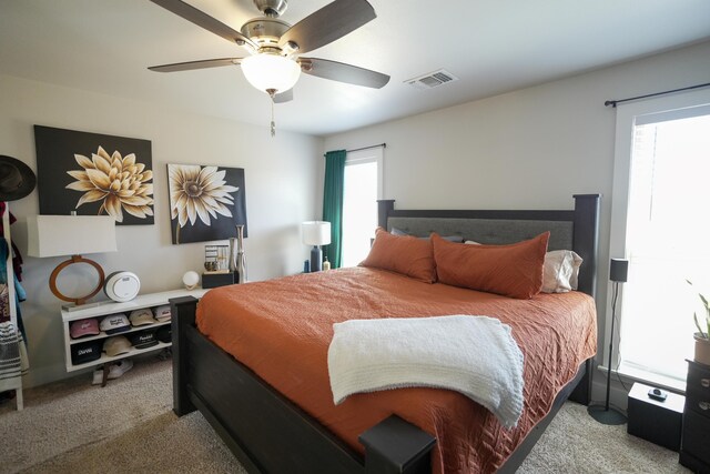7813 89th St, Lubbock, TX 79424 - bedroom with visible vents, carpet flooring, and a ceiling fan