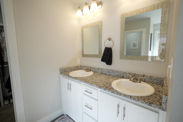 7813 89th St, Lubbock, TX 79424 - bathroom featuring a sink and double vanity