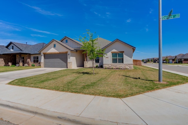 ranch-style home with a front lawn, a garage, driveway, stone siding, and board and batten siding