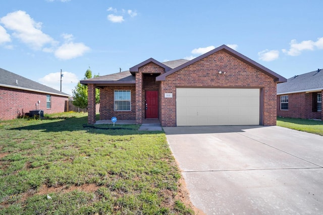 ranch-style home featuring cooling unit, a garage, and a front yard