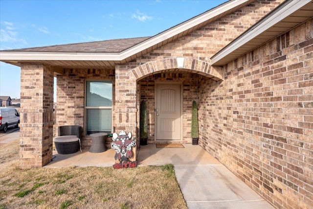 entrance to property with a patio