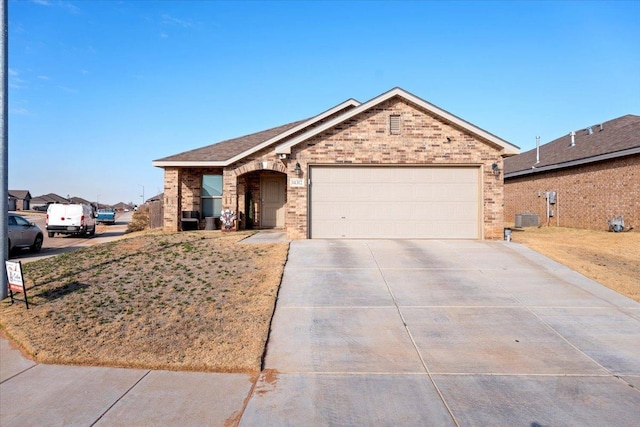 single story home featuring a garage and central AC unit