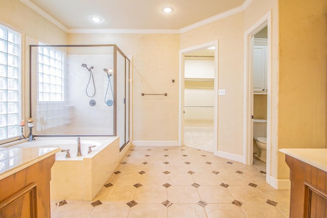 bathroom featuring a garden tub, toilet, a shower stall, and ornamental molding