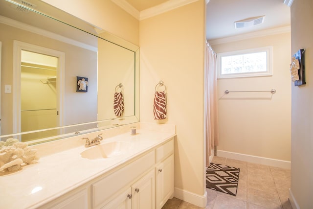 full bath with baseboards, visible vents, ornamental molding, and vanity