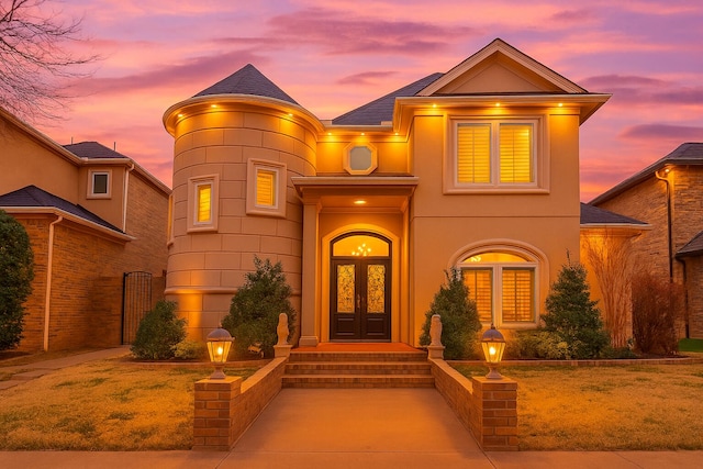 8908 York Pl, Lubbock, TX 79424 - view of front of property featuring french doors, a shingled roof, and stucco siding