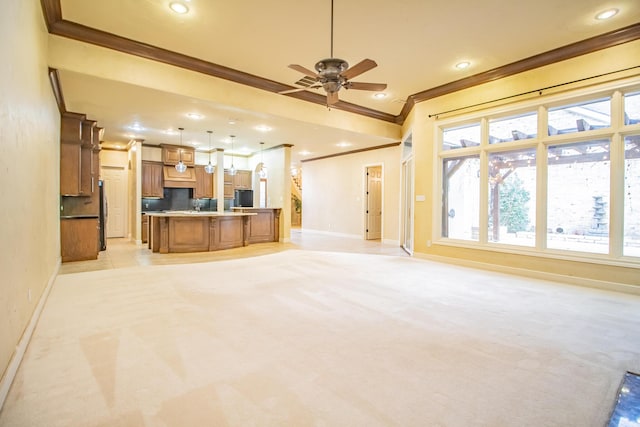 unfurnished living room with recessed lighting, ceiling fan, crown molding, light carpet, and baseboards