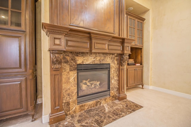 details with baseboards, carpet floors, and a fireplace