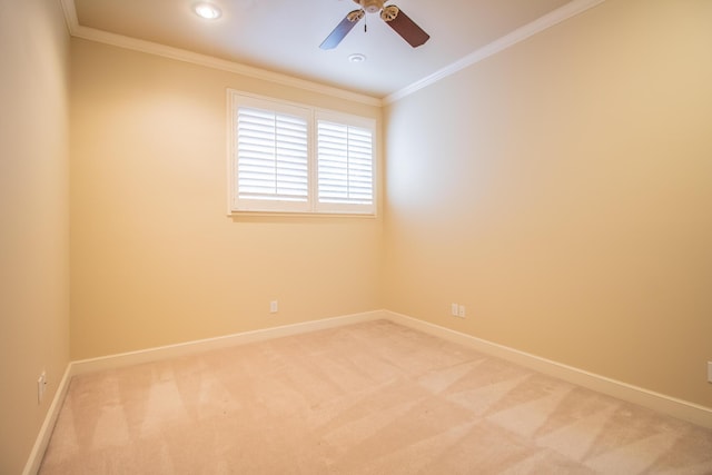 empty room with crown molding, recessed lighting, light colored carpet, and baseboards