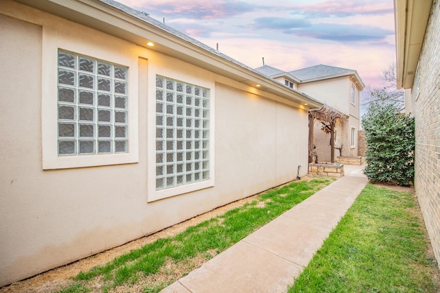 8908 York Pl, Lubbock, TX 79424 - view of property exterior with stucco siding