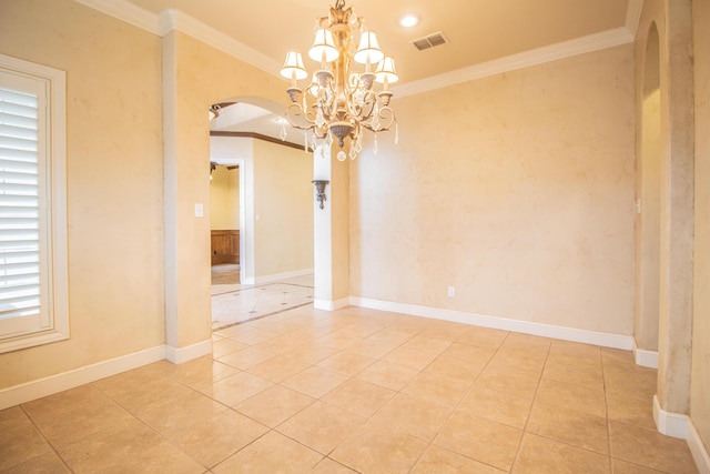 unfurnished room with visible vents, a chandelier, ornamental molding, and arched walkways