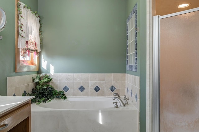 bathroom with vanity and independent shower and bath