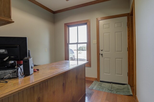 office featuring ornamental molding and hardwood / wood-style floors