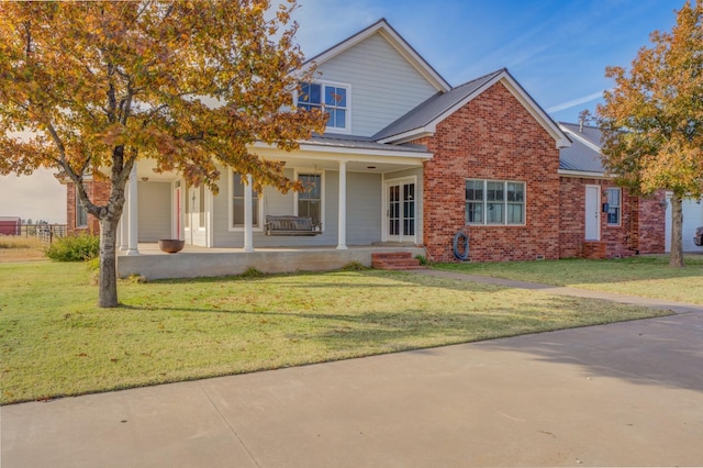 view of front of house with a porch and a front lawn