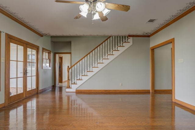 interior space featuring french doors, crown molding, and light wood-type flooring