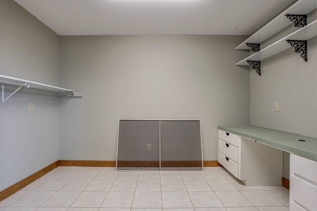 spacious closet with light tile patterned flooring