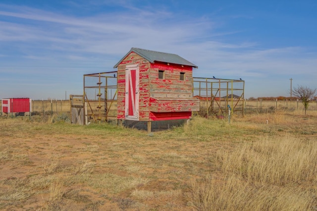 view of outdoor structure featuring a rural view